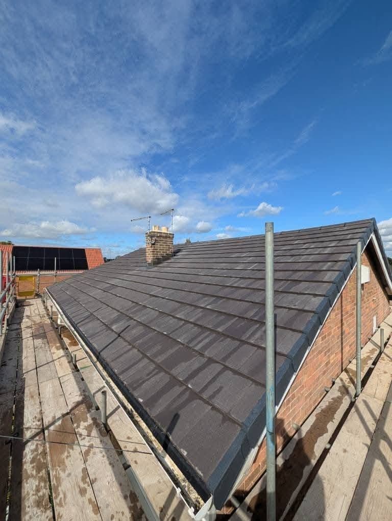 Completed bungalow re-roof with scaffold still up