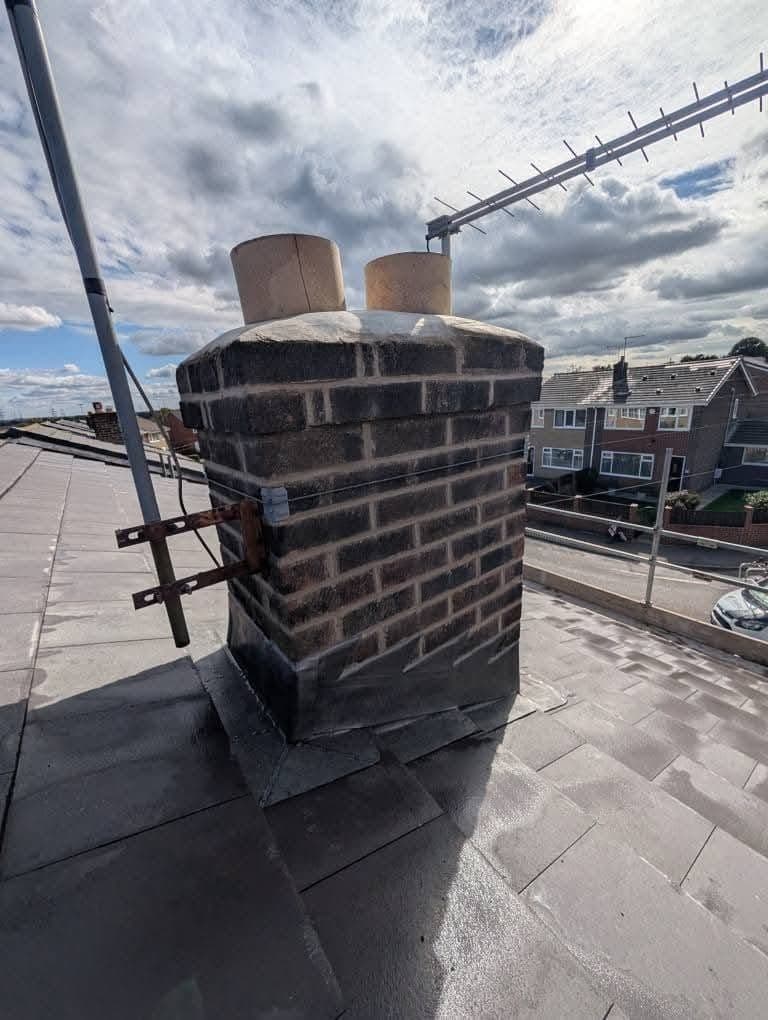 Chimney stack with new flashing at roof level