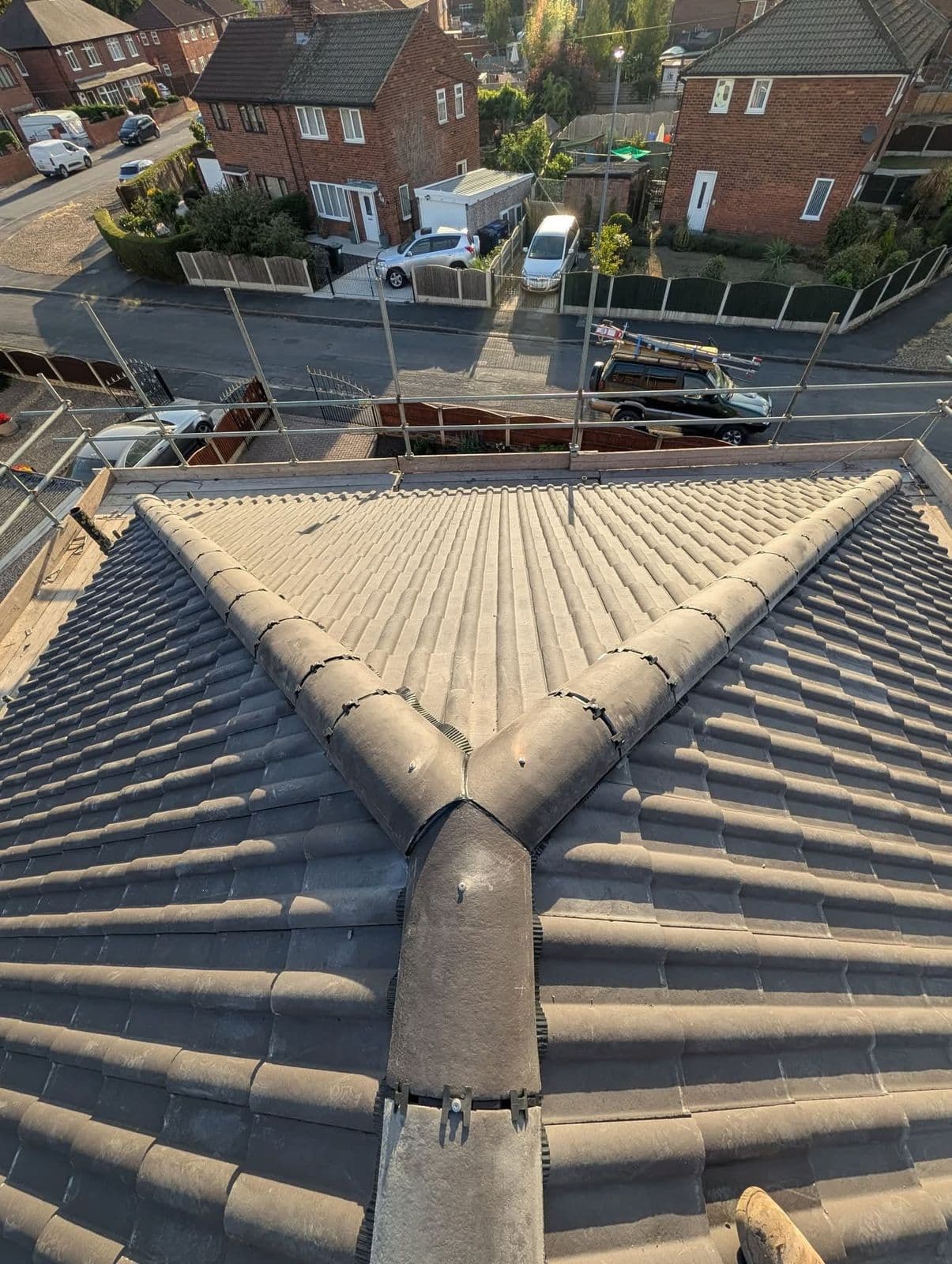 Dry-fix hip and ridge on concrete interlocking tiles