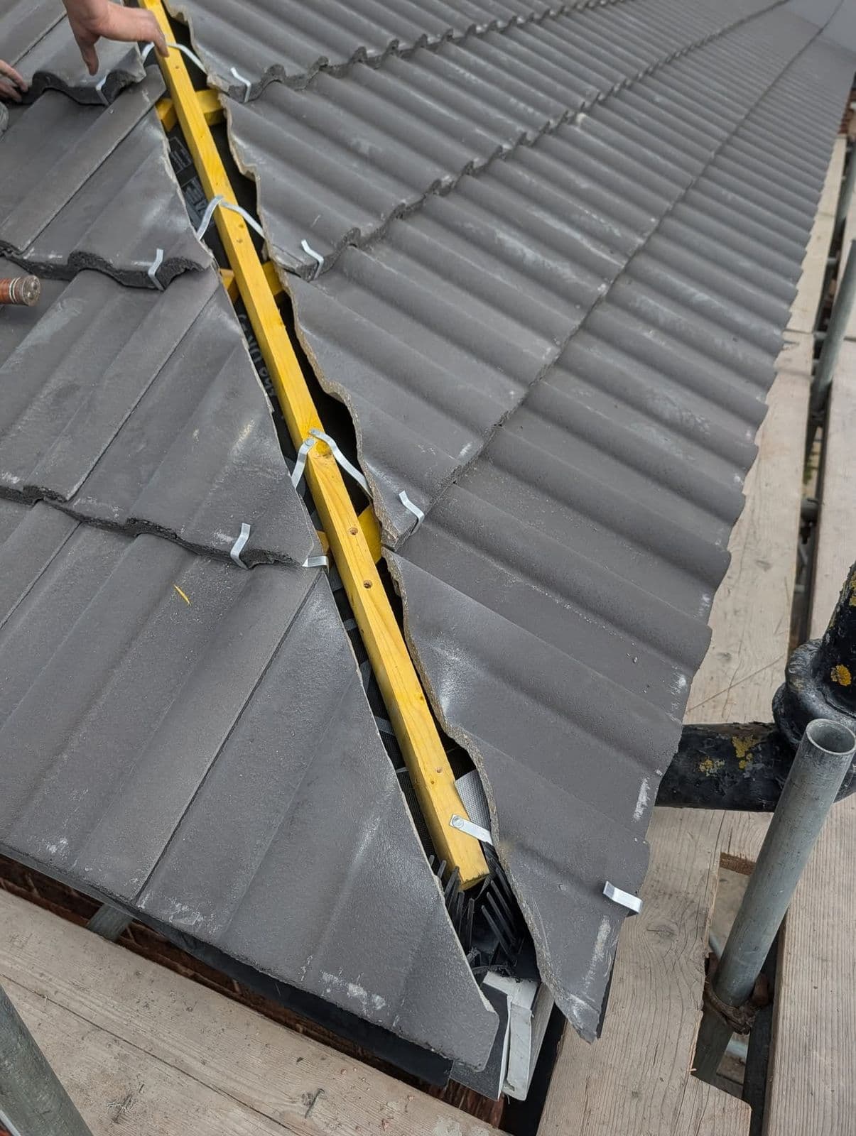 Dry valley being fitted on a new tiled roof