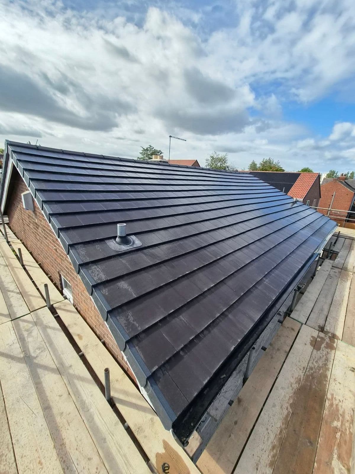 Full length of a newly tiled bungalow roof