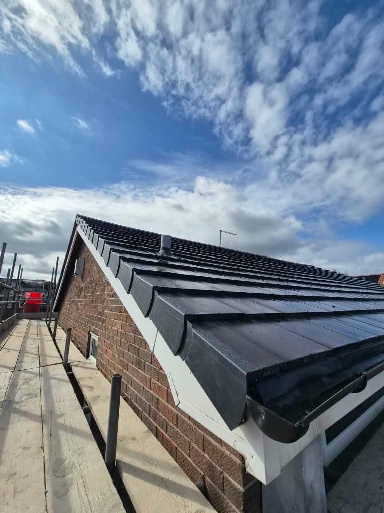 New roof with dry verge, white fascias and black guttering