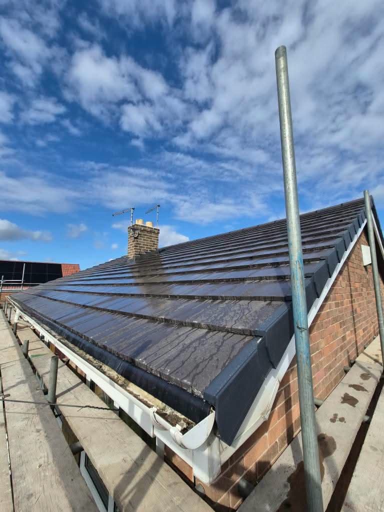 Completed re-roof with chimney and new ridge