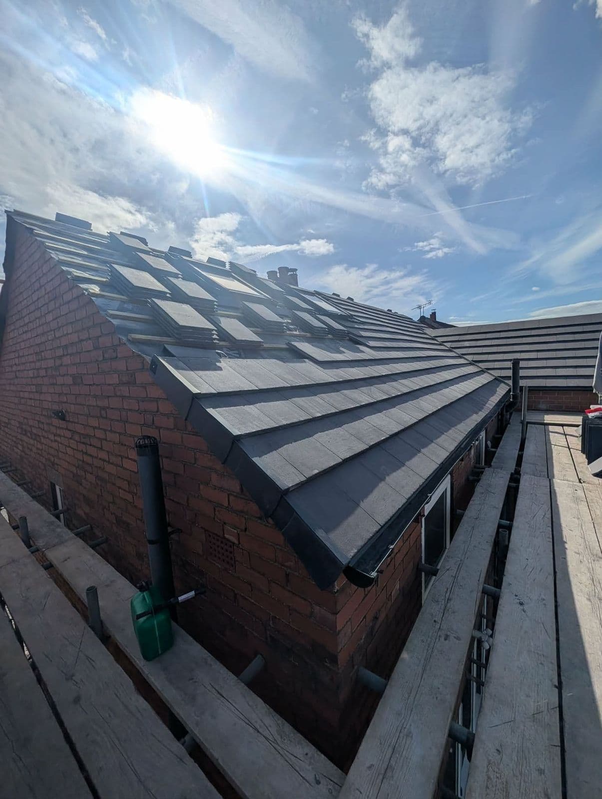 Finished slate-effect tile roof on a bungalow