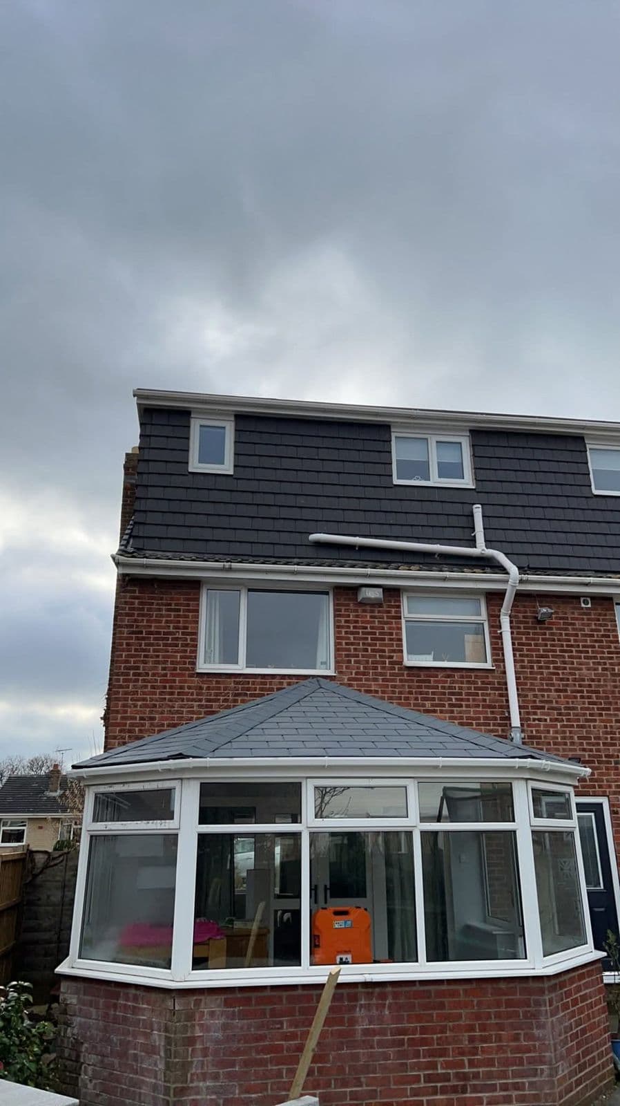 Tiled conservatory roof at the rear of a house